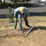 installing the overflow pipe in the rain garden