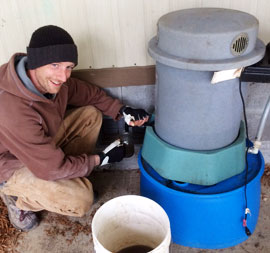 Pete from Udan Farm, pouring compost tea