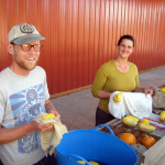 Incubator farmers washing produce outside the Headwaters barn